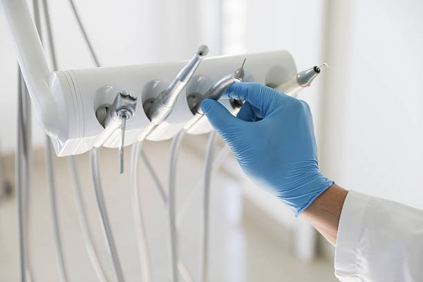 Professional Tooth Extraction technician working in Ouachita Parish County, LA